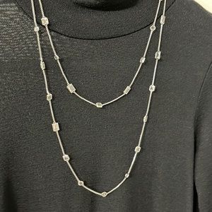 Long silver and clear stone necklace by Mickael Kors